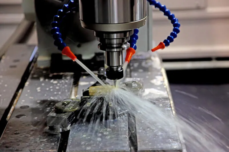 CNC milling machine cutting an aluminium part